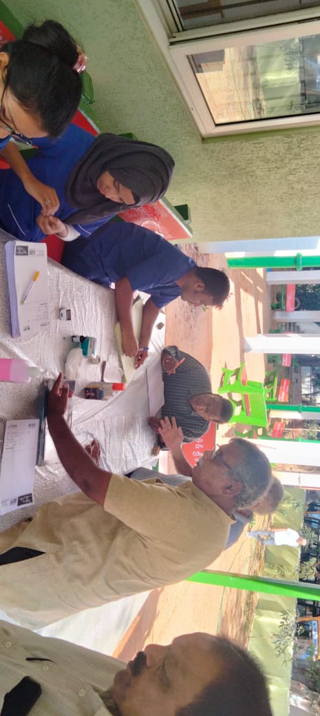 Sample collection for GRBS at Health Camp.jpeg